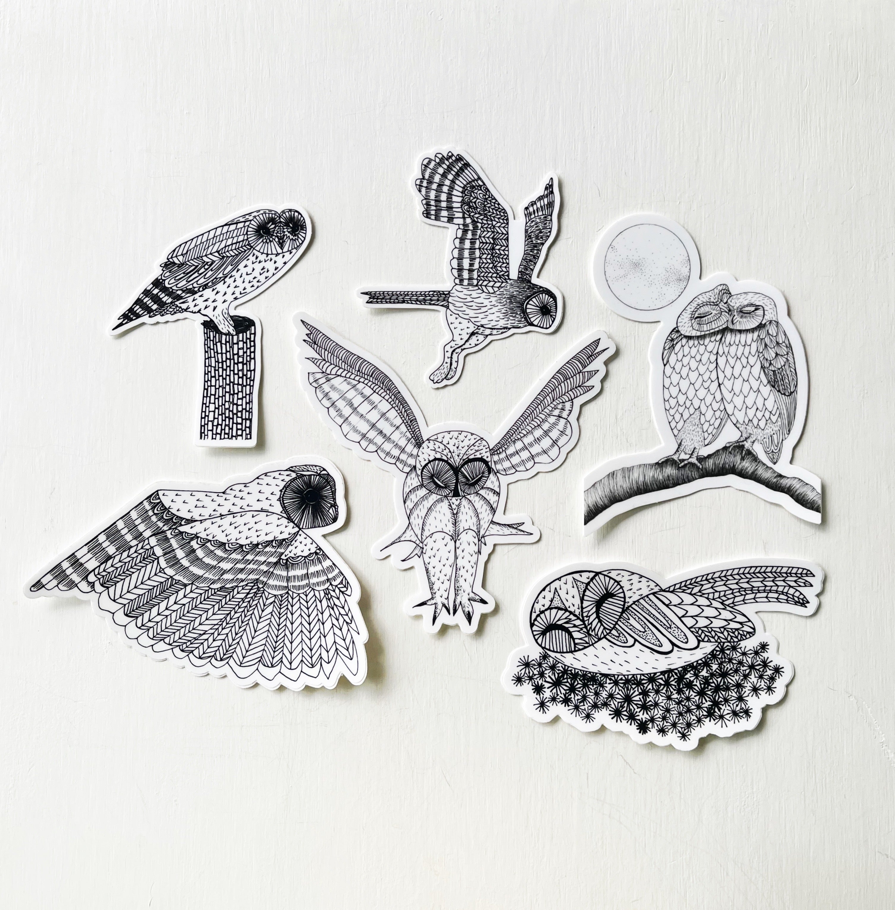 A set of six owl stickers drawn in black on white background.